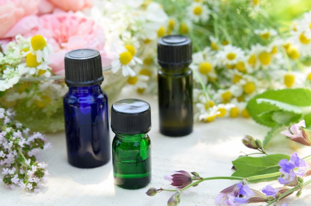 essential oils with herbal flowers